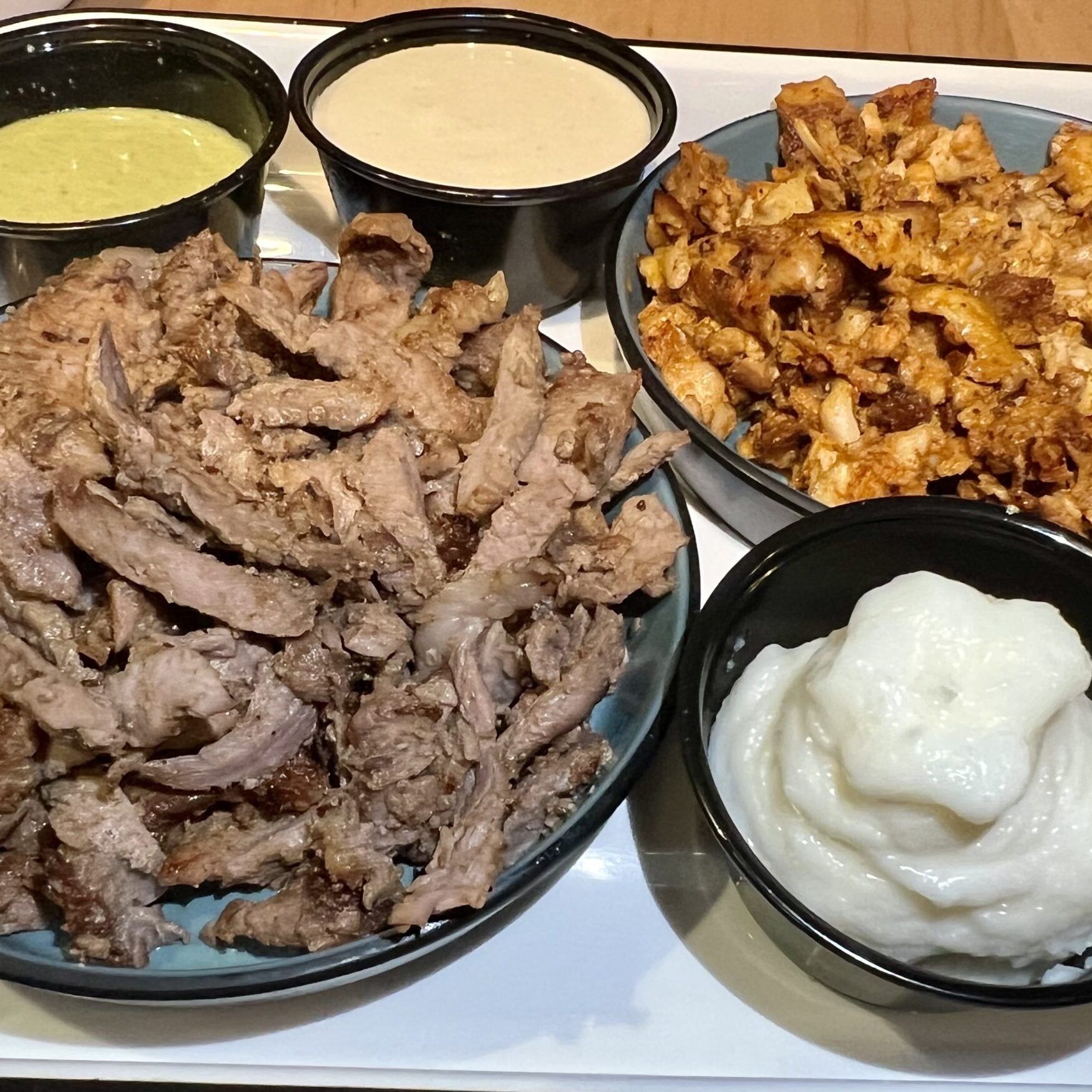 Beef-Shawarma-with-garlic-tahini-harissa-and-cucumber-labneh-Brad-Blankenship-1-2235